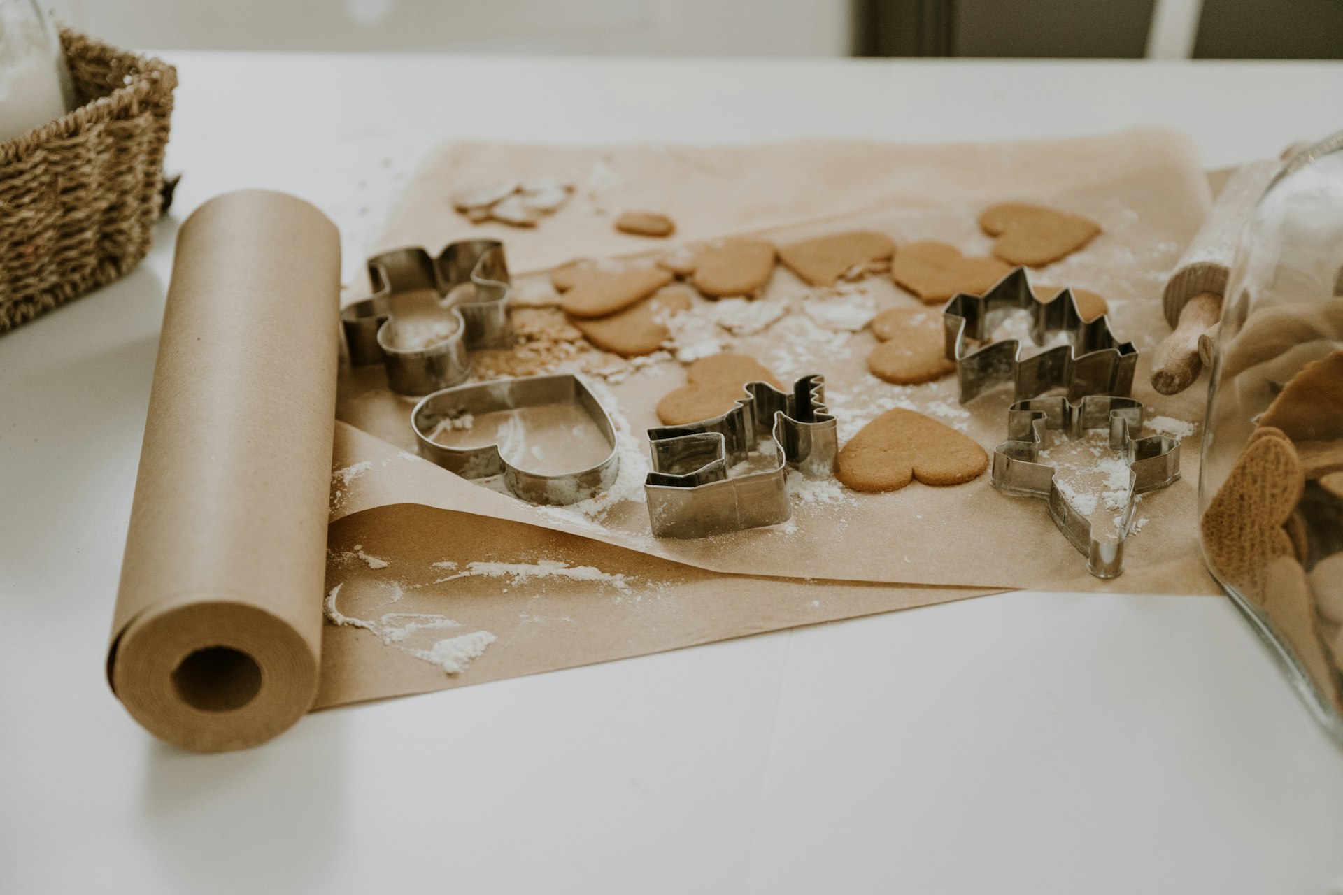 A table topped with cookie cutters and cookies